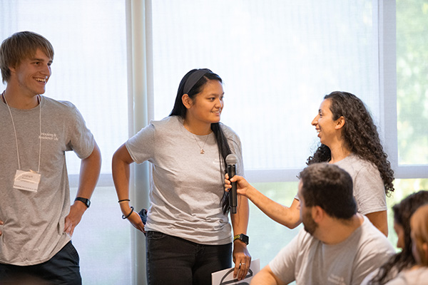 Staff holds up microphone for RA